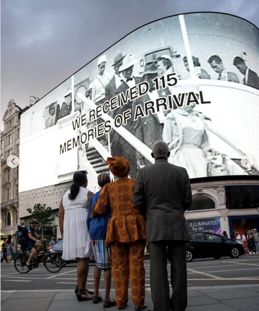 CIRCA and Black Cultural Archives celebrate Windrush 75th anniversary. Creative Contributors look up at the Piccadilly Lights screen in Piccadilly Circus, London